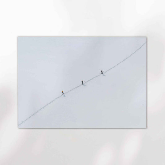 Chamonix Alps minimalist print showing a diagonal alpine route trekked by climbers over crisp white snow.