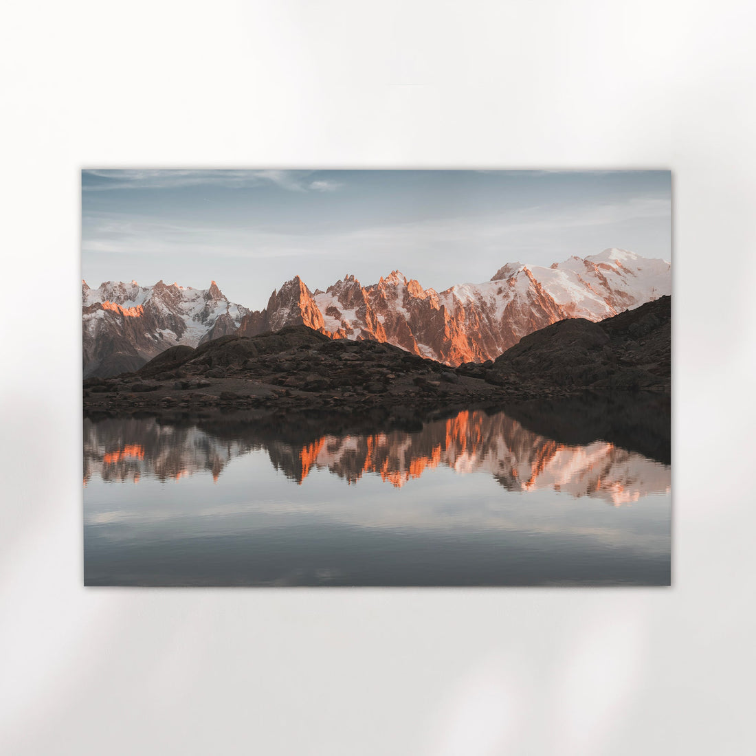 Chamonix photography print capturing Lac Blanc with fiery mountain reflections and a pastel alpine sky.