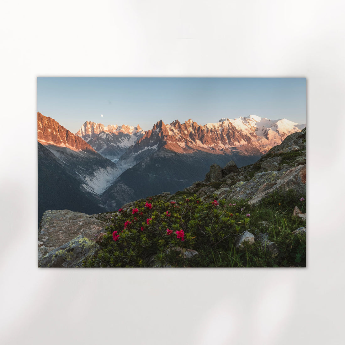 Fine art sunset print of the Chamonix Aiguilles and Mont Blanc Massif, glowing under soft evening light.