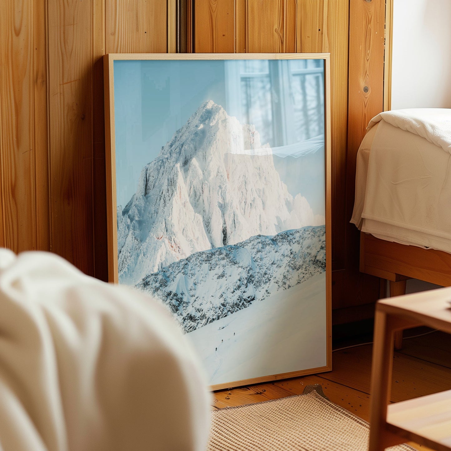 Backcountry ski tourers in Chamonix, making their way across untouched alpine terrain with towering peaks behind.