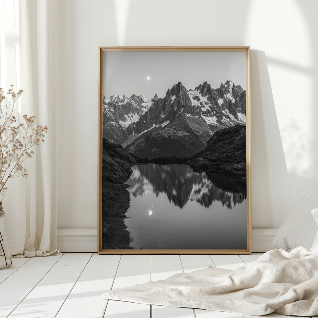 Elegant black and white print of Lac de la Flégère at dusk, with the moon rising over rugged alpine peaks.