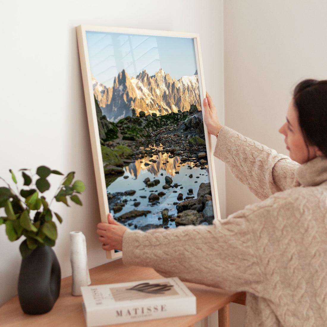 Captivating hiking trail in Chamonix, leading to a peaceful mountain pond reflecting the towering French Alps.