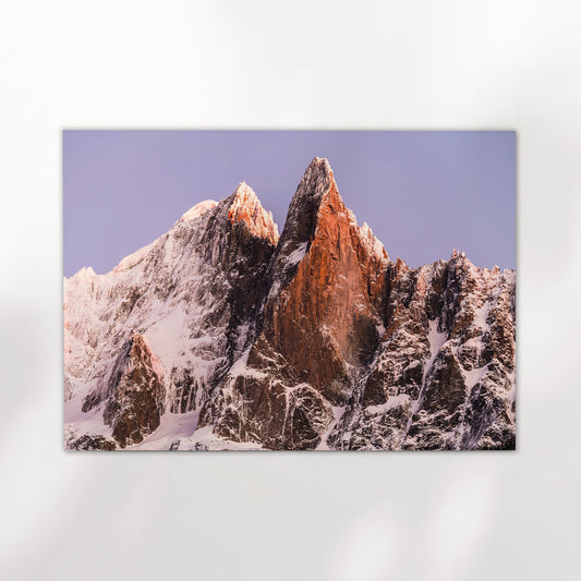 Chamonix wall art print featuring the dramatic twin peaks of Les Drus catching soft alpine light in the French Alps.