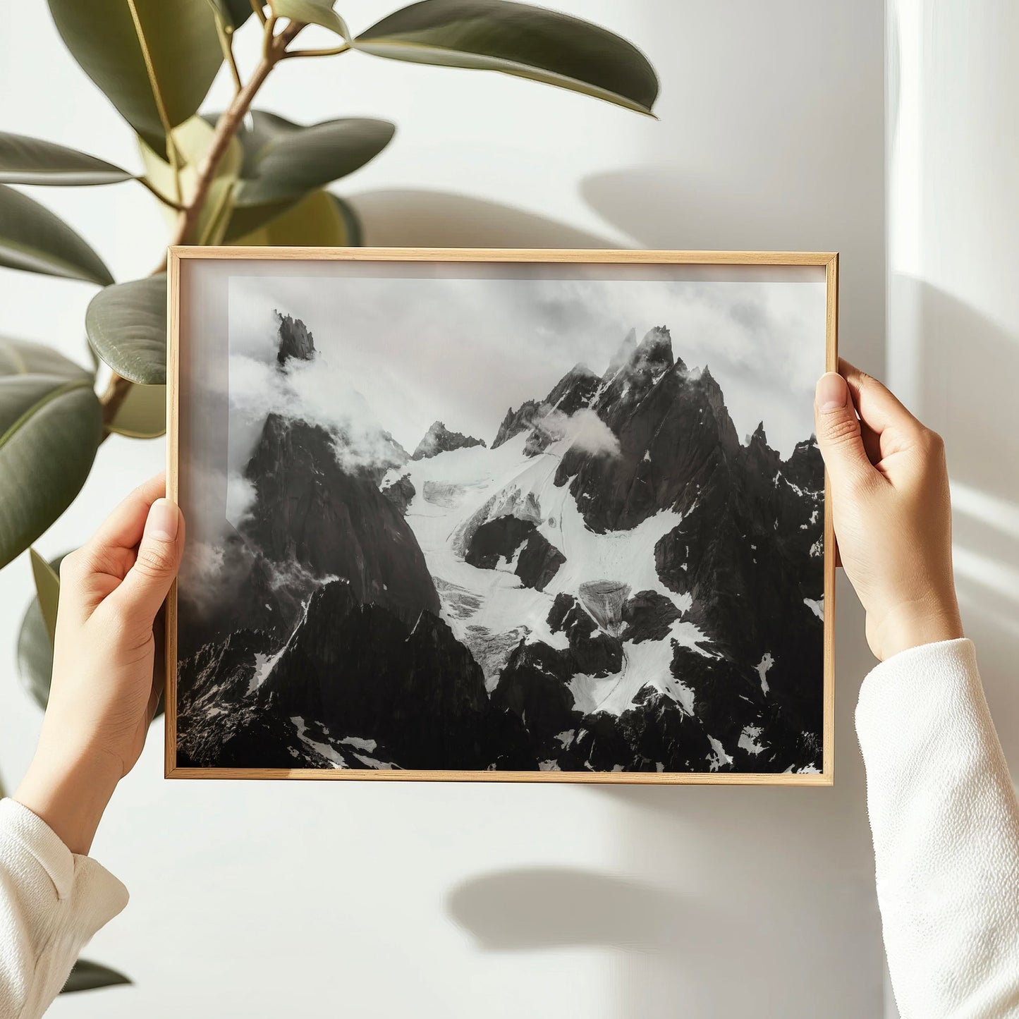 Moody monochrome Alps photography print capturing the raw textures of the Chamonix Aiguilles under cloud cover.