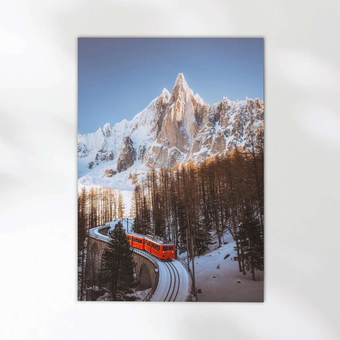 Chamonix's famous Montenvers Train framed by winter landscapes, a perfect alpine photography print for mountain lovers.