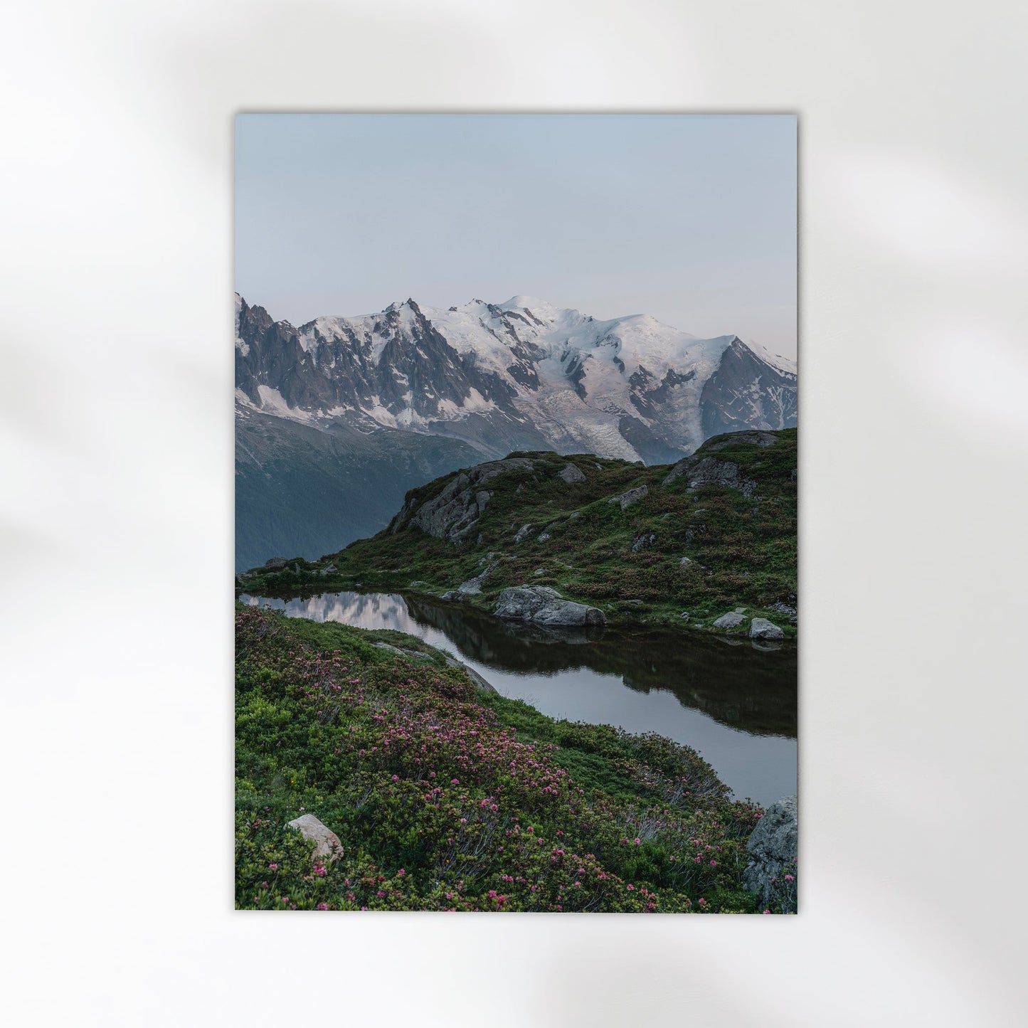 Scenic Chamonix mountain landscape with a crystal-clear mirror lake reflecting the snow-capped peaks.