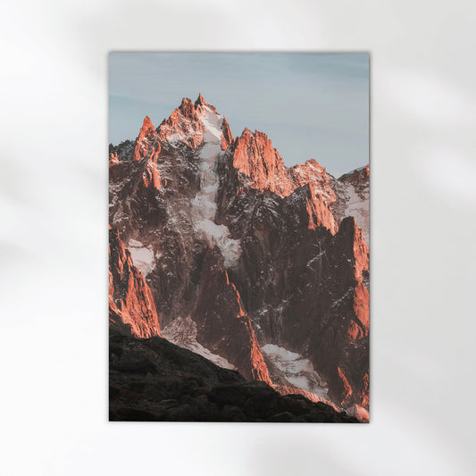 Stunning Chamonix mountain photography print capturing the sharp peaks reflected in a serene alpine pool.