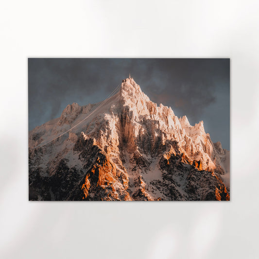 Chamonix mountain sunrise photo print capturing Aiguille du Midi glowing with warm alpine light.
