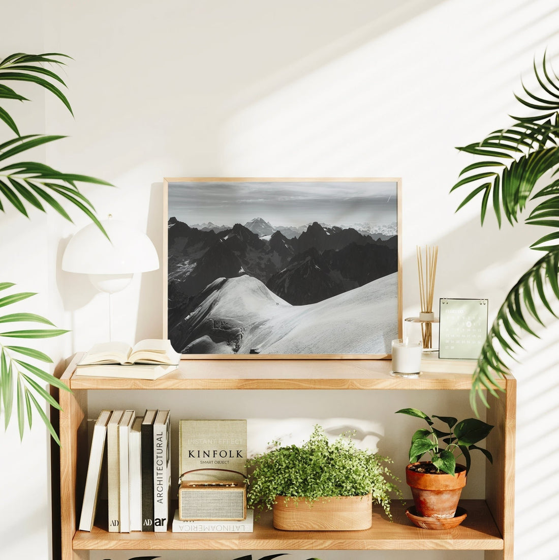 Chamonix mountaineers captured trekking across high alpine terrain in this dramatic monochrome print.