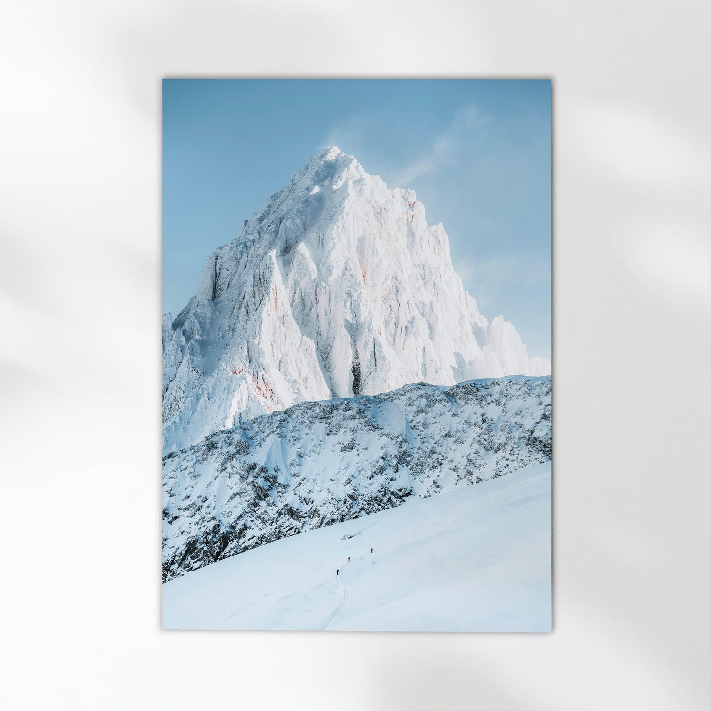 Scenic ski touring adventure in Chamonix with two mountaineers ascending the pristine alpine slopes of Mont Blanc.