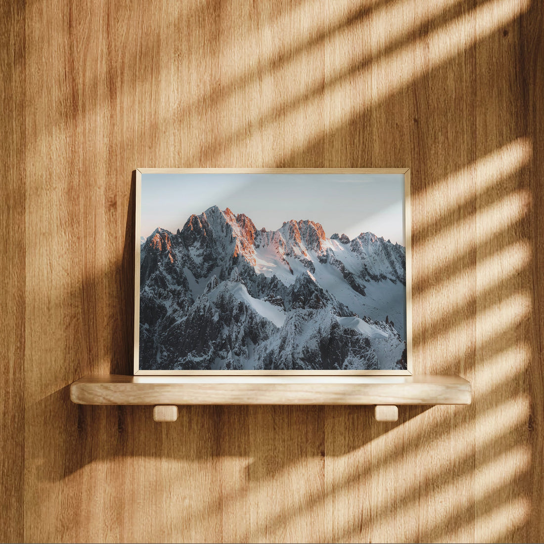 Snow-covered summits of Chamonix’s iconic peaks glowing in golden morning light, printed on premium matte paper.