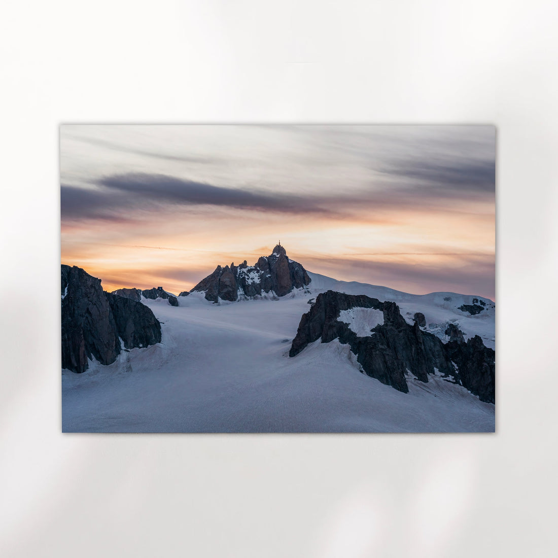 Chamonix sunset mountain photography print with warm alpine light over jagged peaks and glacier terrain.