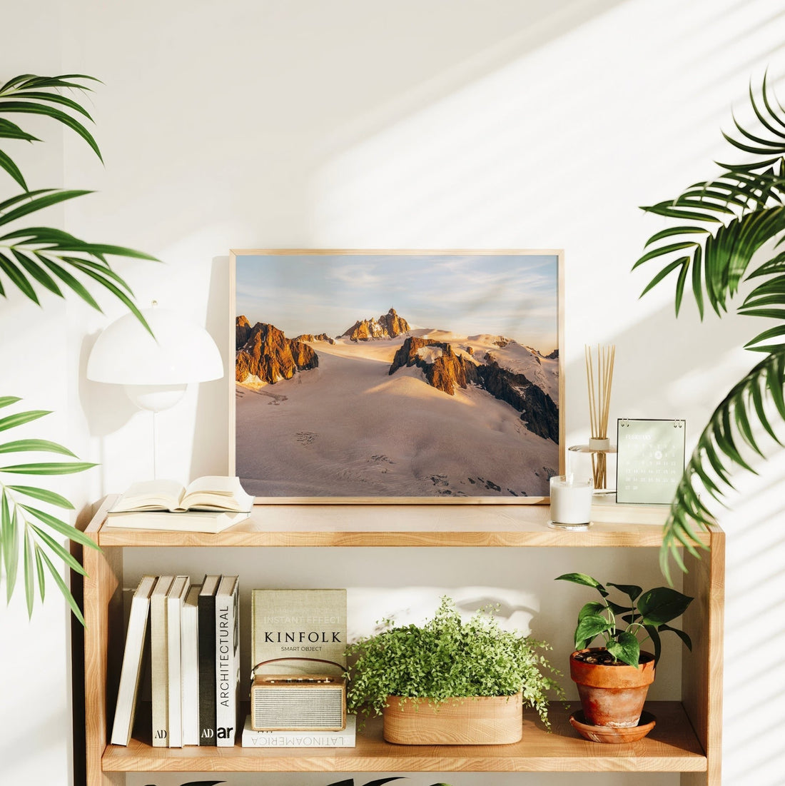 Premium Chamonix wall art print of Aiguille du Midi glowing at sunset above a rolling glacier field.