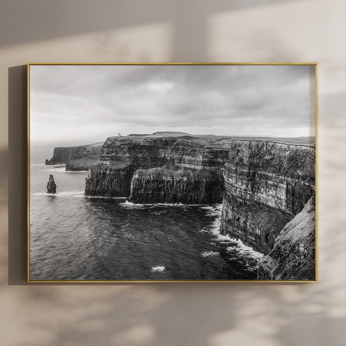 Black and white photo print of the Cliffs of Moher on a wall