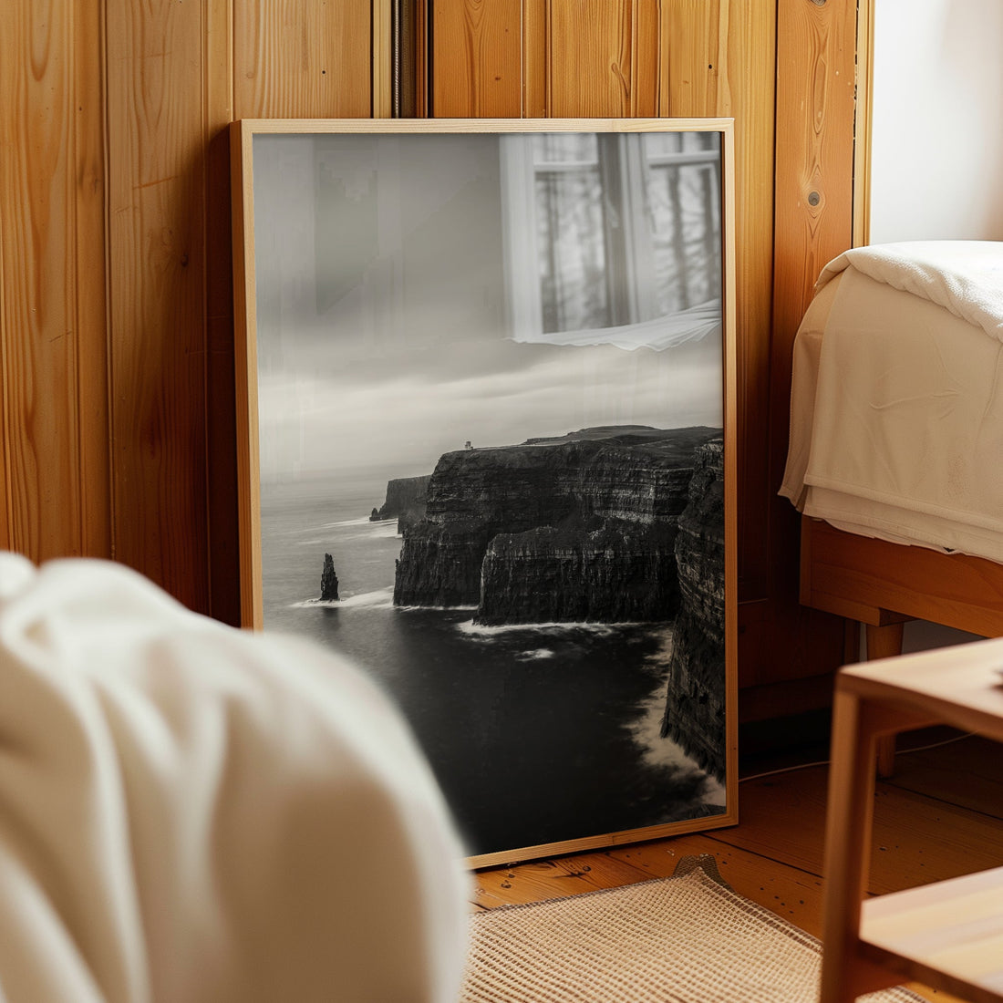 Monochrome Irish coast print of Cliffs of Moher leaning against bedroom wall
