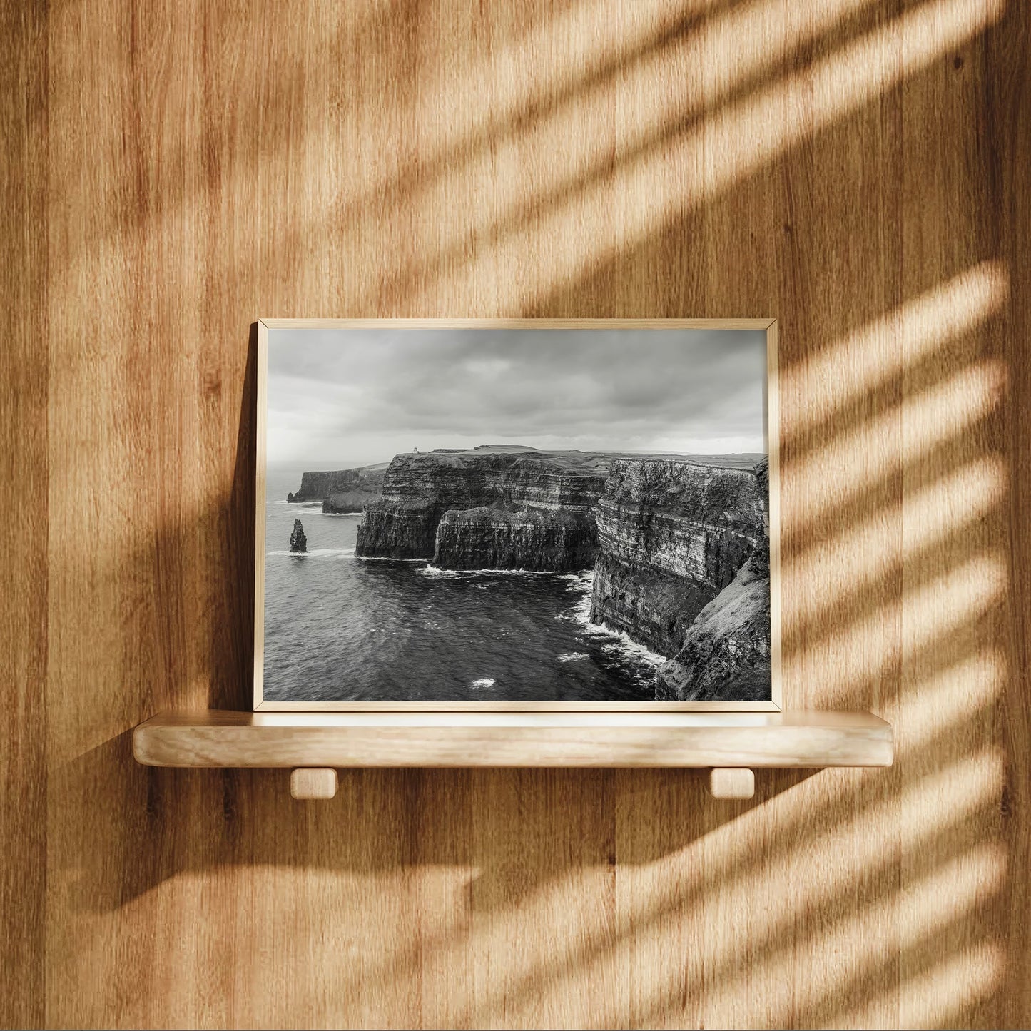 Cliffs of Moher photography displayed on a wooden shelf