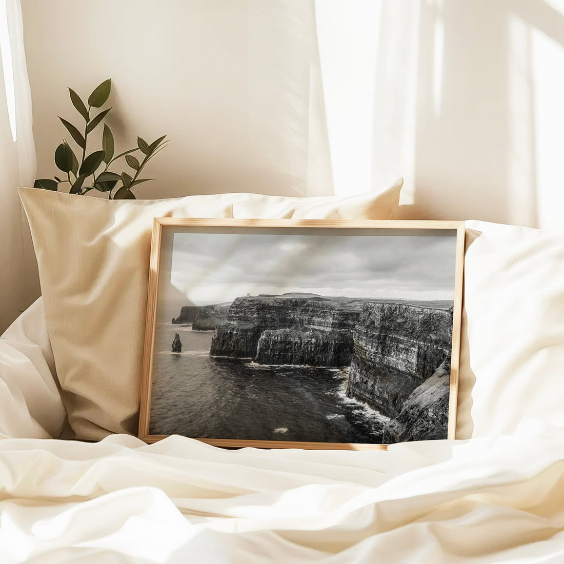 Coastal print of Cliffs of Moher resting on white bedding