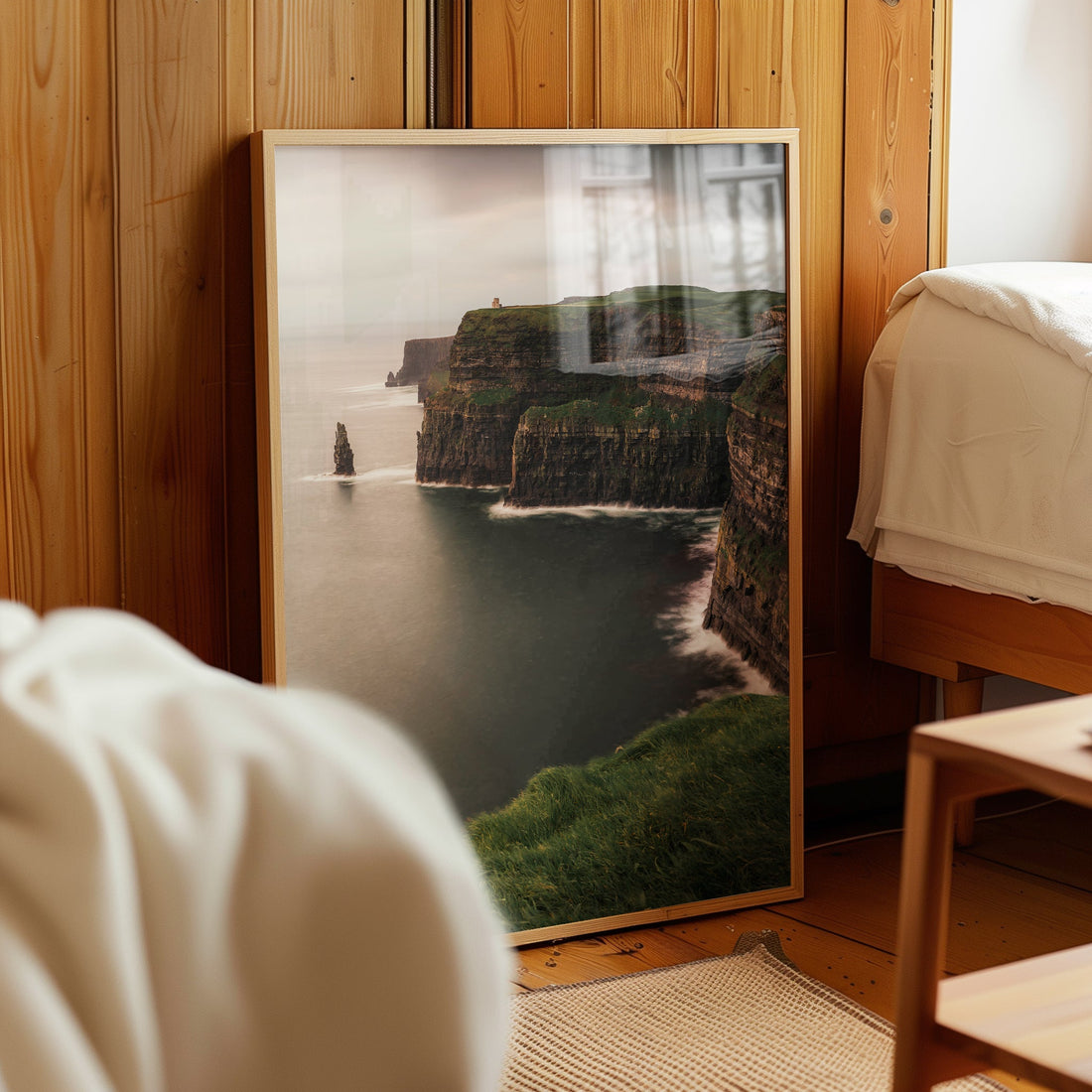 Nature photography print of Ireland’s Cliffs of Moher in a wooden bedroom