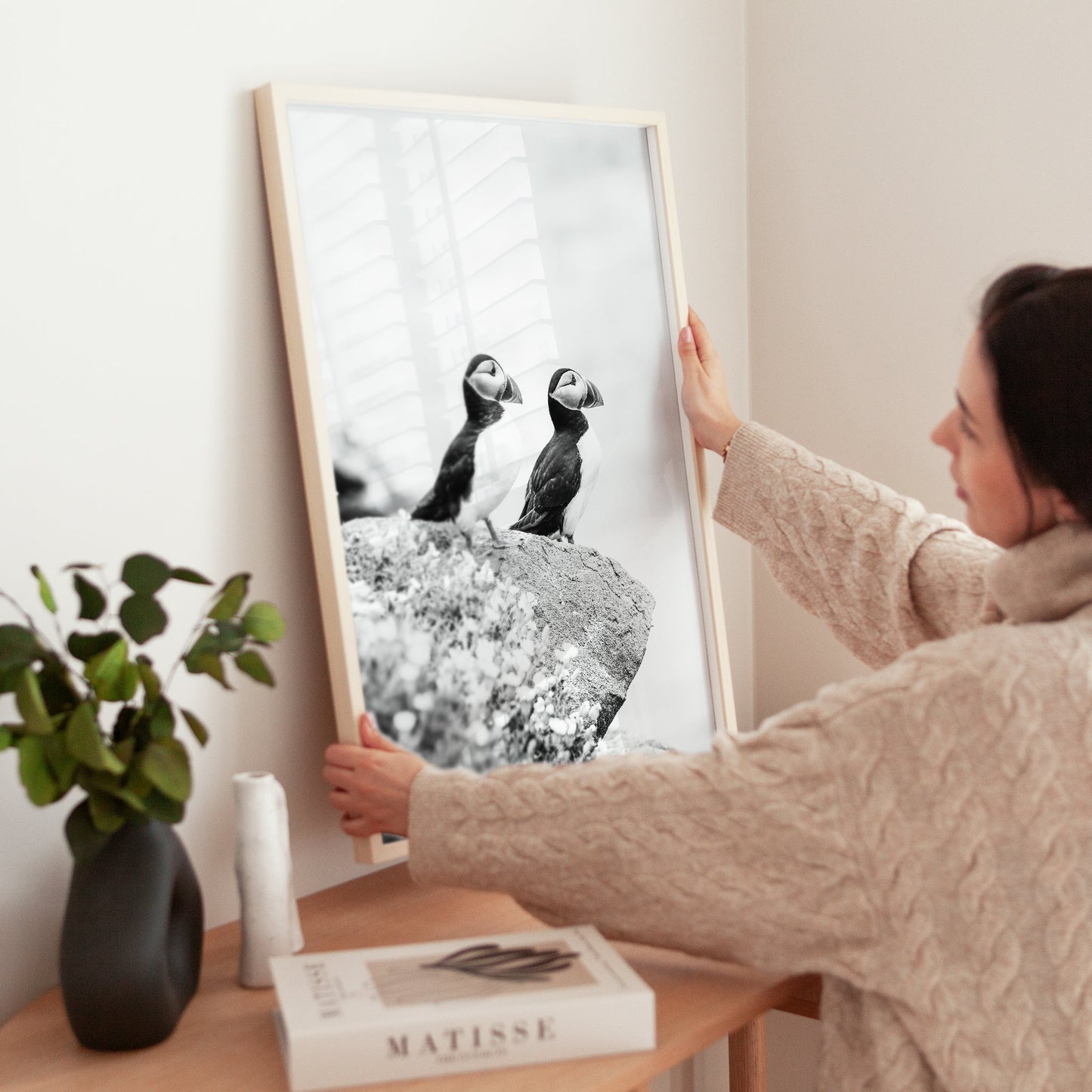Wildlife photo print of puffins in a gold frame with shadowed light.