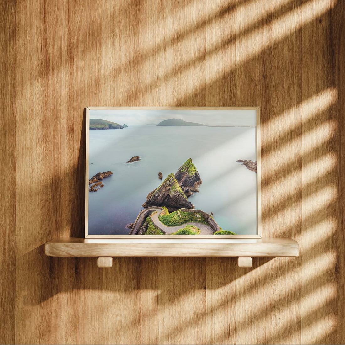 Ireland’s iconic Dunquin Pier print displayed on wood wall shelf