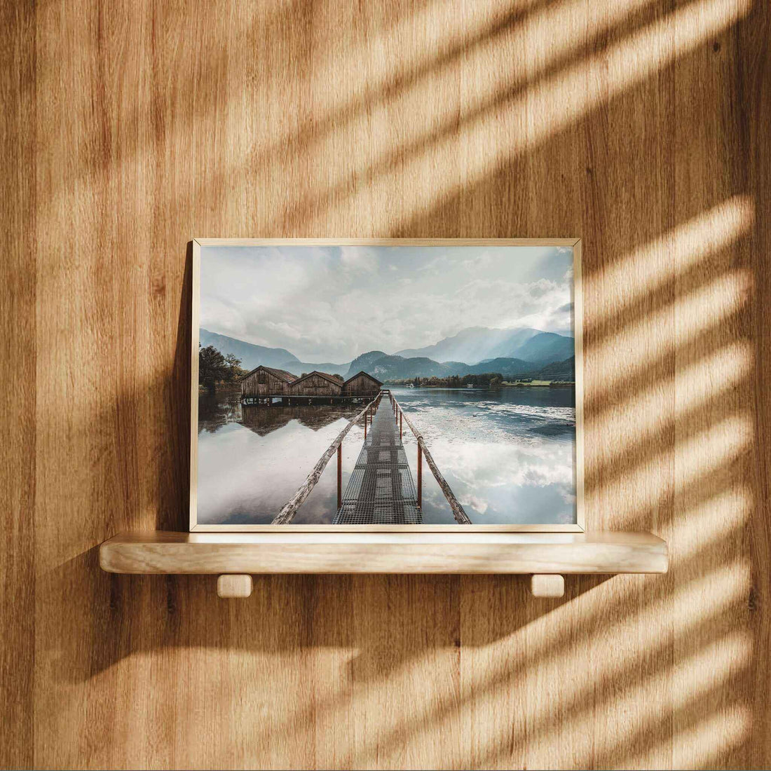Interior styled with Kochelsee lake print showing rustic huts and reflections