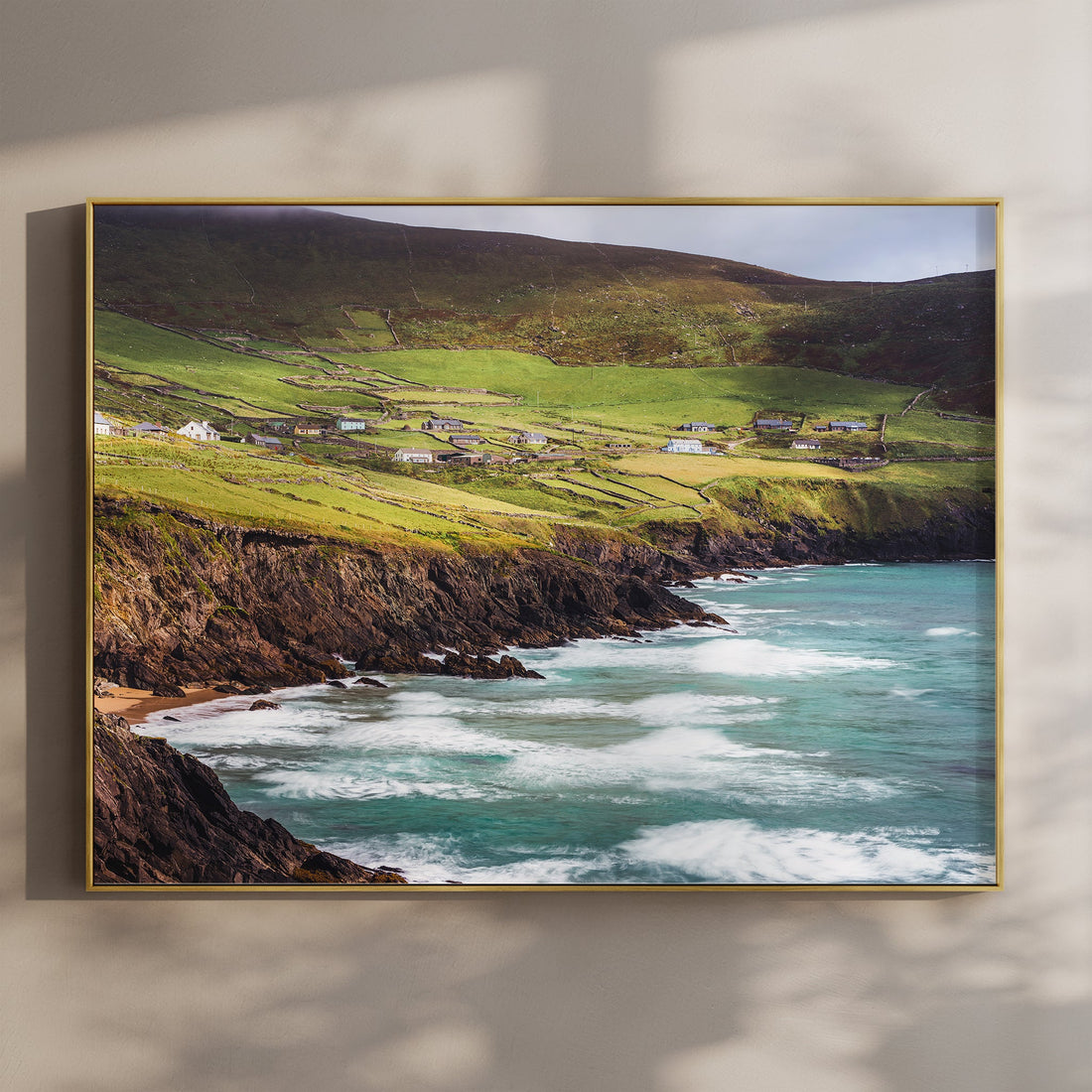 Coumeenoole Beach on the Dingle Peninsula with waves crashing below lush green hills