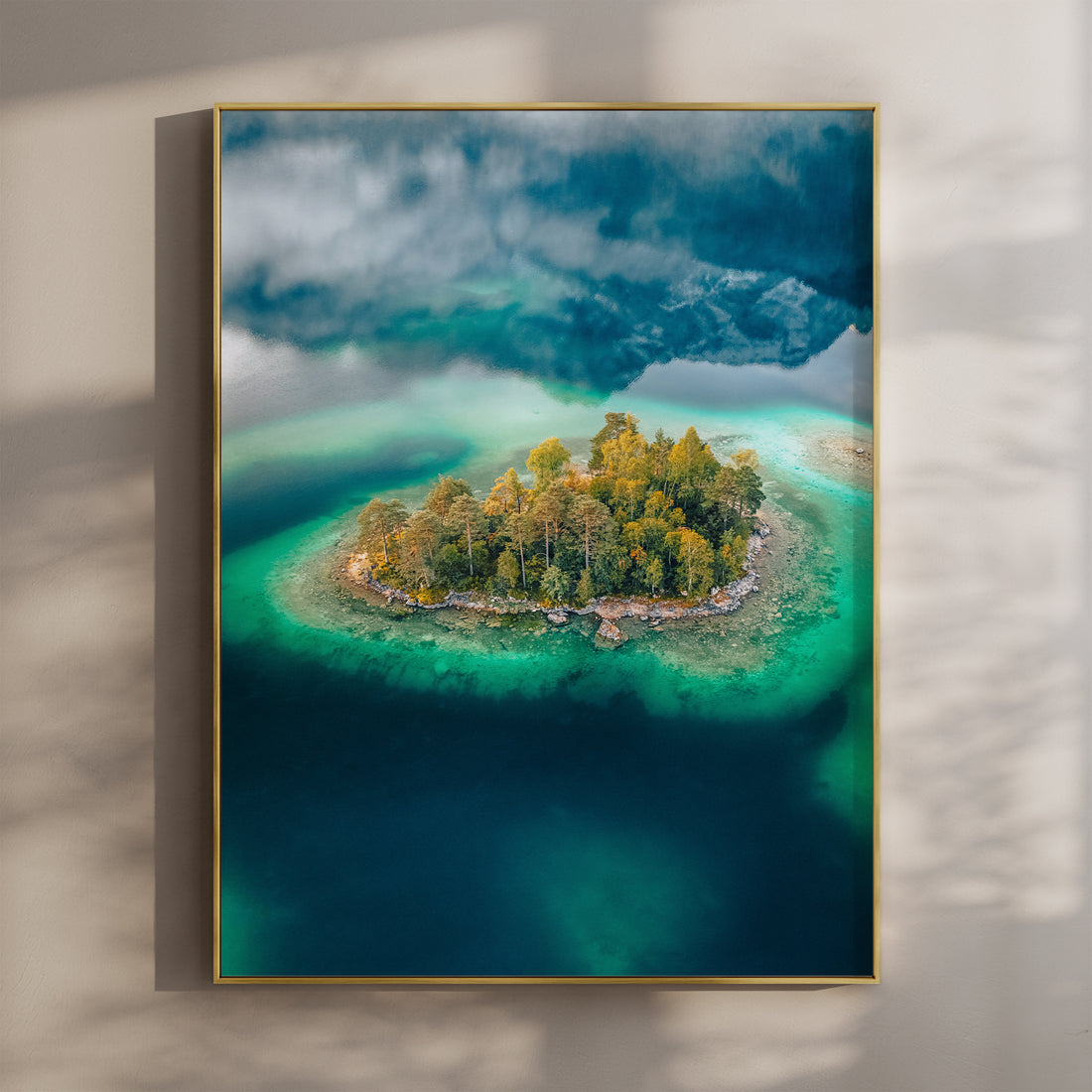 Aerial view of a small forested island in Eibsee with turquoise water in Bavaria
