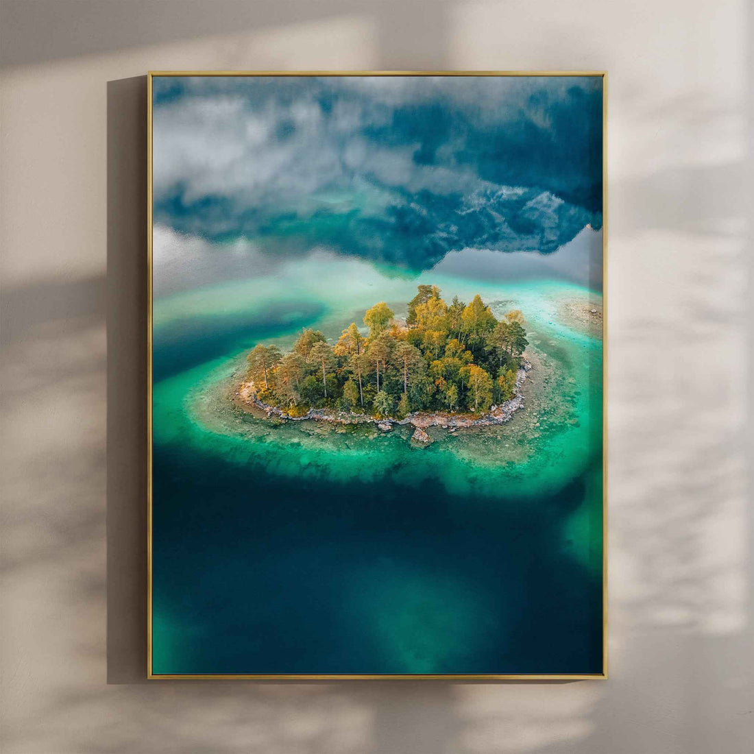 Aerial view of a small forested island in Eibsee with turquoise water in Bavaria