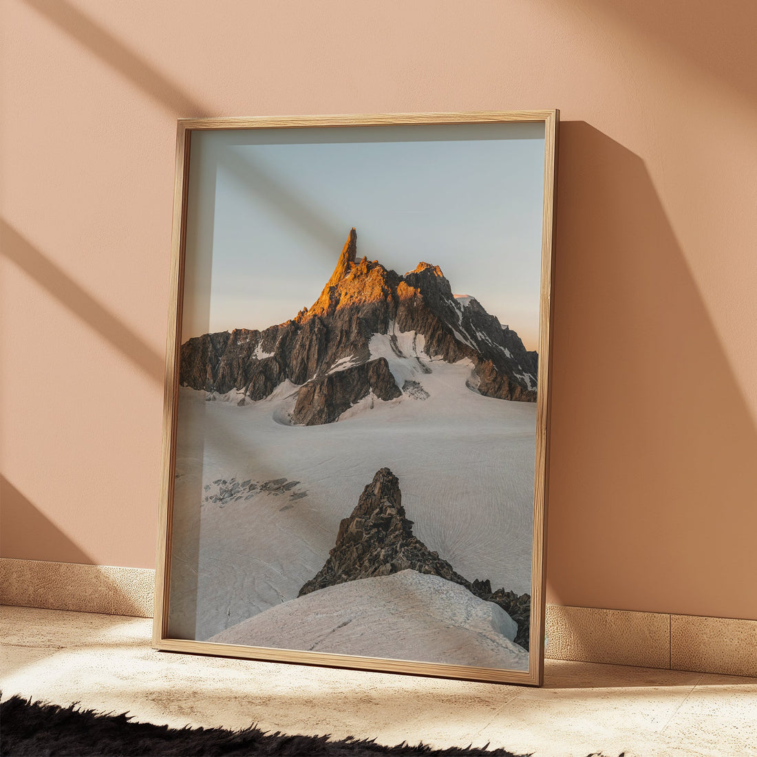 Modern mountain wall decor featuring the sharp peaks of Dent du Géant in a soft alpine glow.