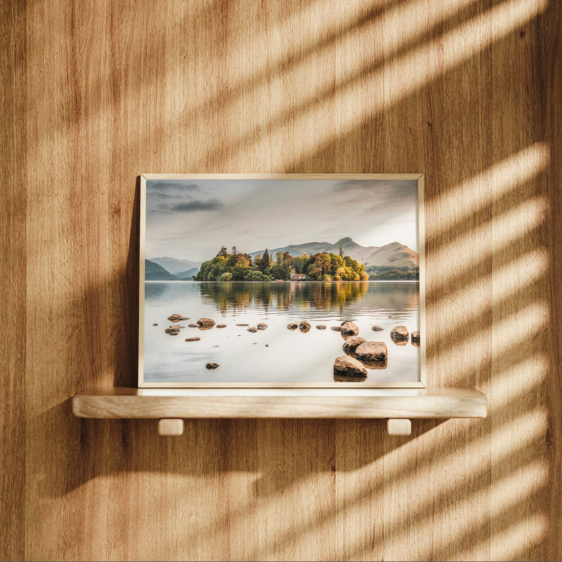 Derwentwater print on a wooden shelf with soft natural shadows