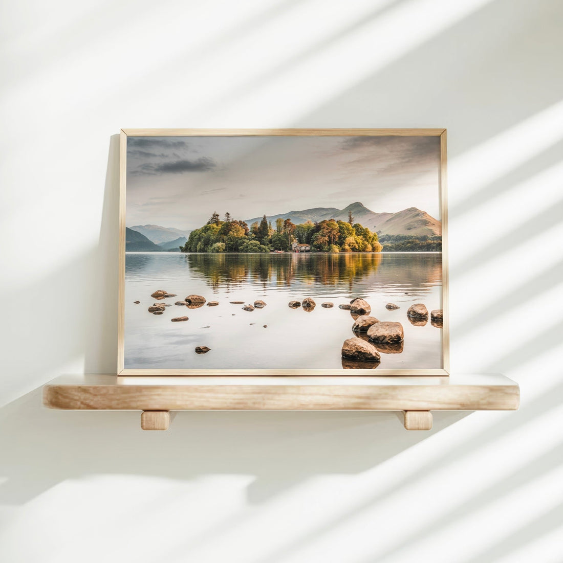 Derwentwater framed wall art print on bright white wall shelf