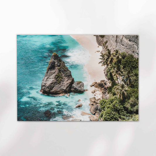 Diamond Beach Nusa Penida landscape aerial photography print with turquoise ocean rock stack and palm trees unframed on white background