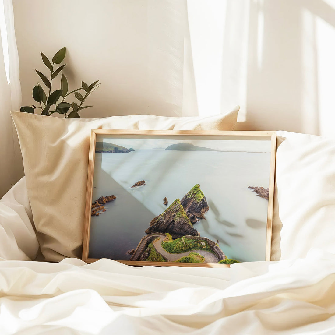 Irish coastal road print with soft pastel tones and calm water