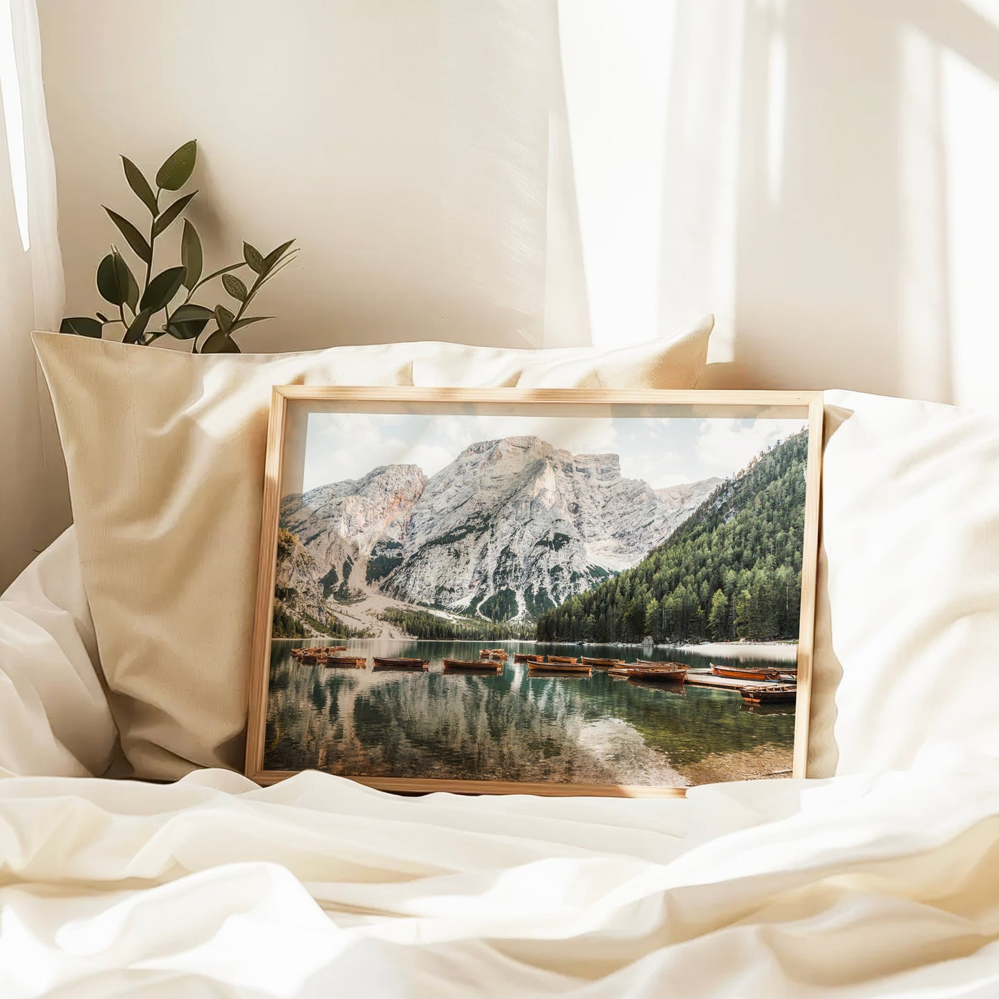 Tranquil boat scene on Lago di Braies in the Dolomites, beautifully captured as wall decor with mountain reflections.