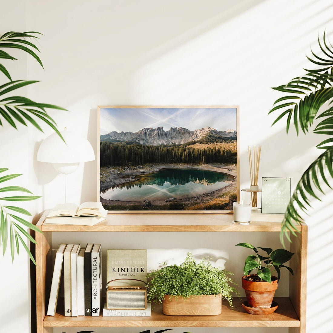 Lago di Carezza wall print styled in bright interior with books and plants