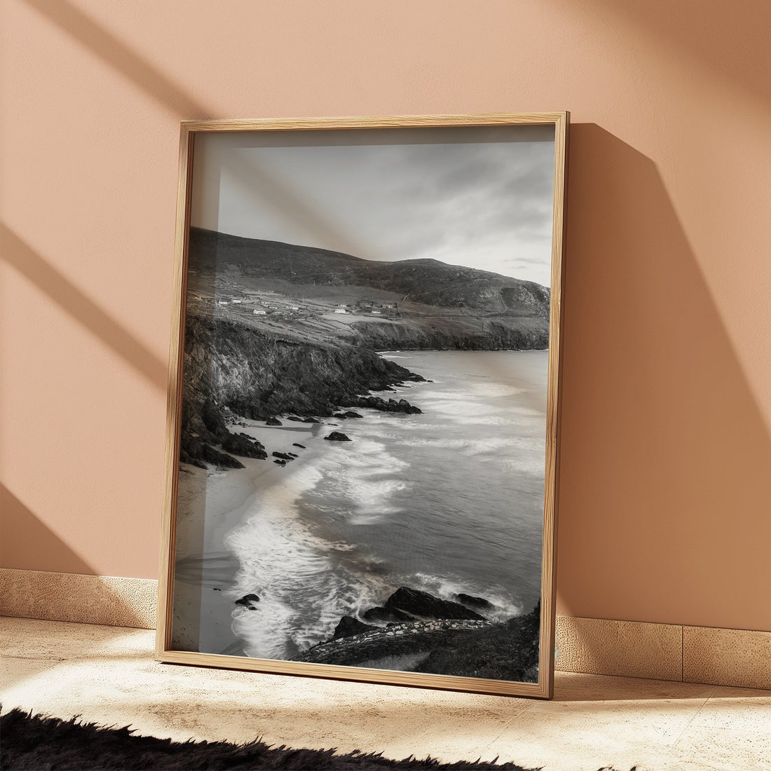 Irish coastal black and white photograph with waves and headland in minimalist decor