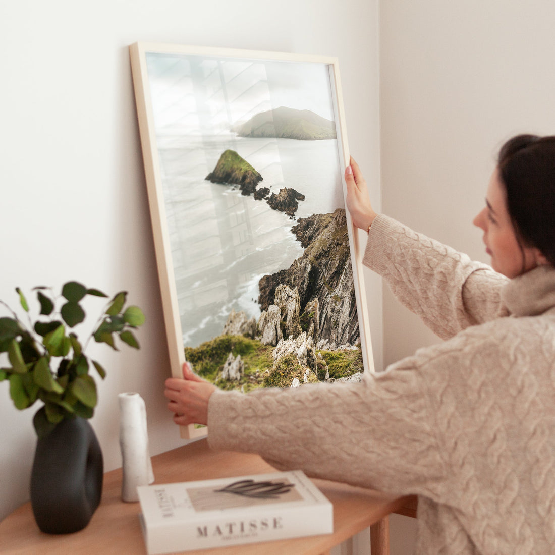 Modern interior decor featuring a framed Dunmore Head Irish coastal scene