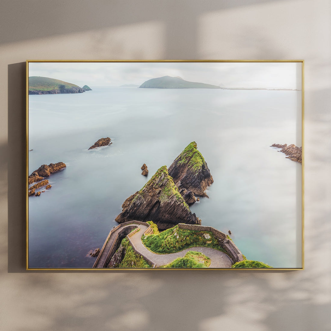Dunquin Pier framed wall art print with golden frame and ocean backdrop