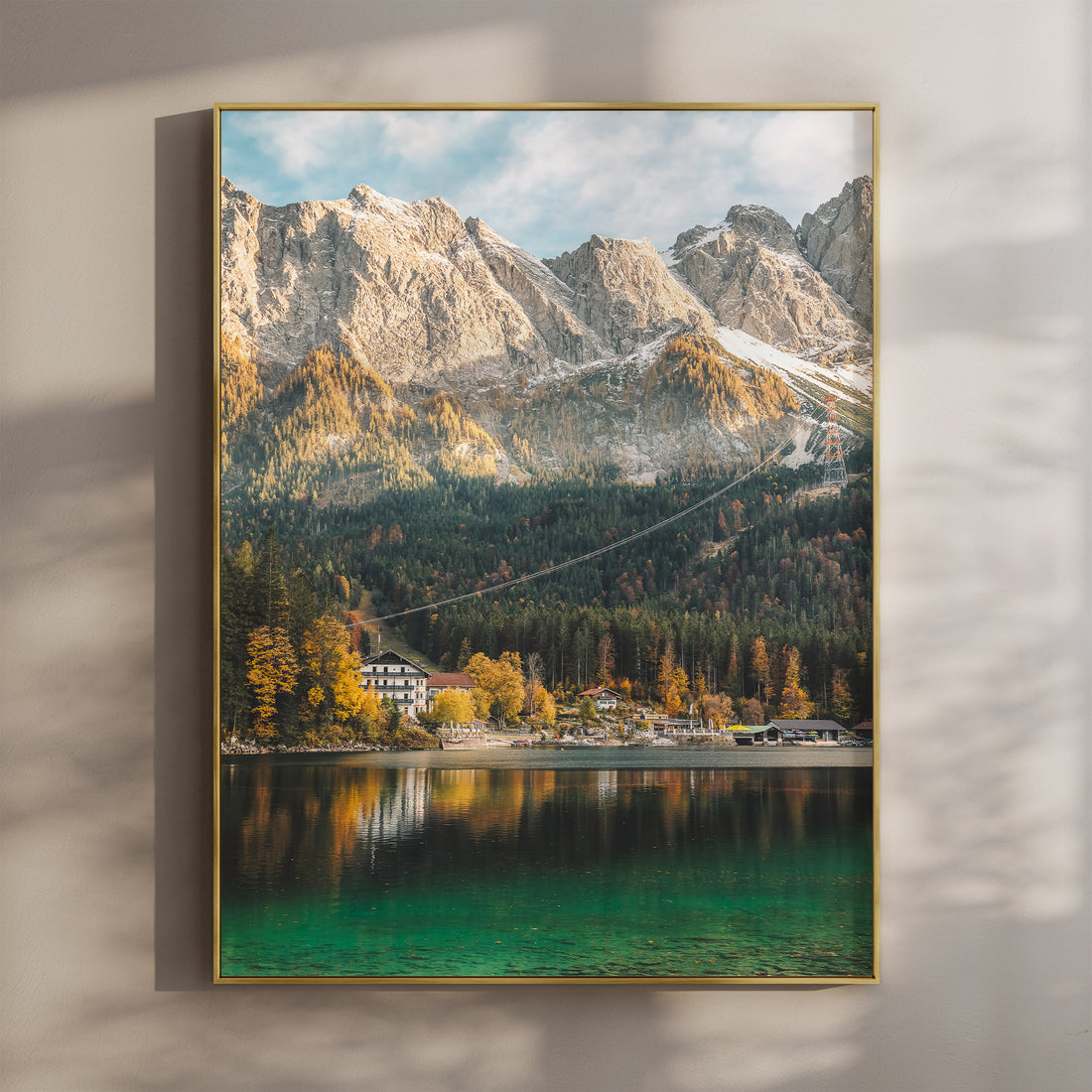 Eibsee lake in autumn with golden trees, clear water and rugged Bavarian Alps