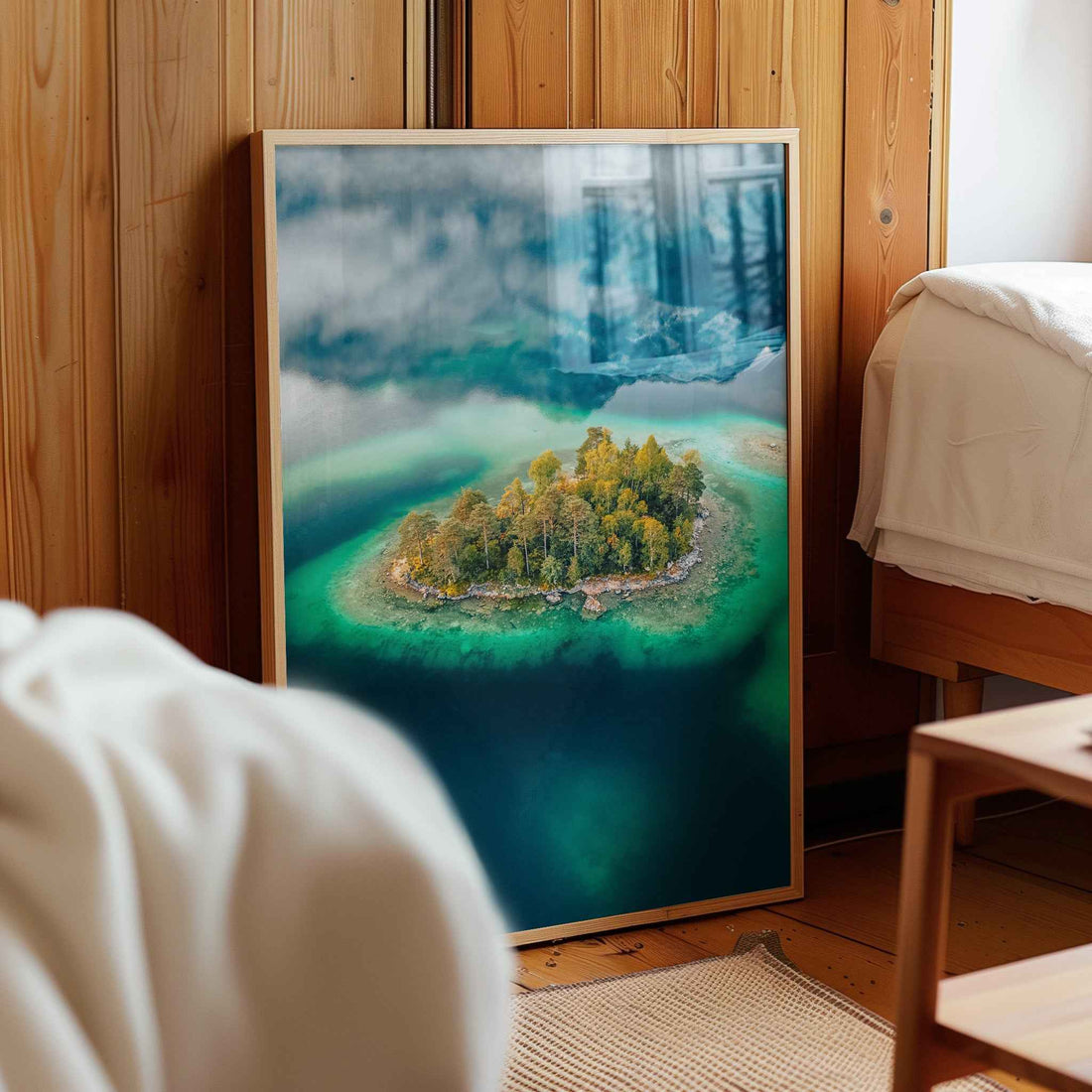 Nature print of Eibsee island leaning in rustic wooden bedroom setting