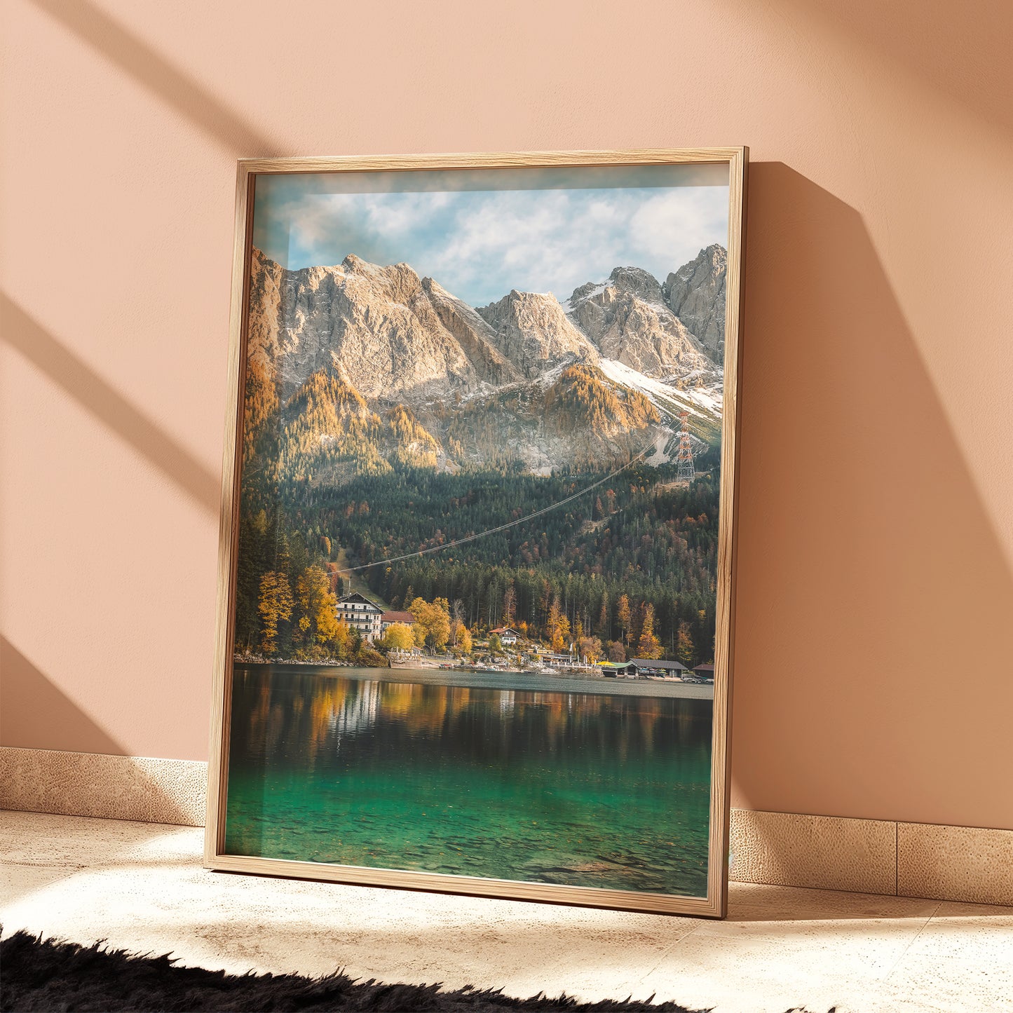 Autumn mountain scene of Eibsee with emerald water and forest backdrop