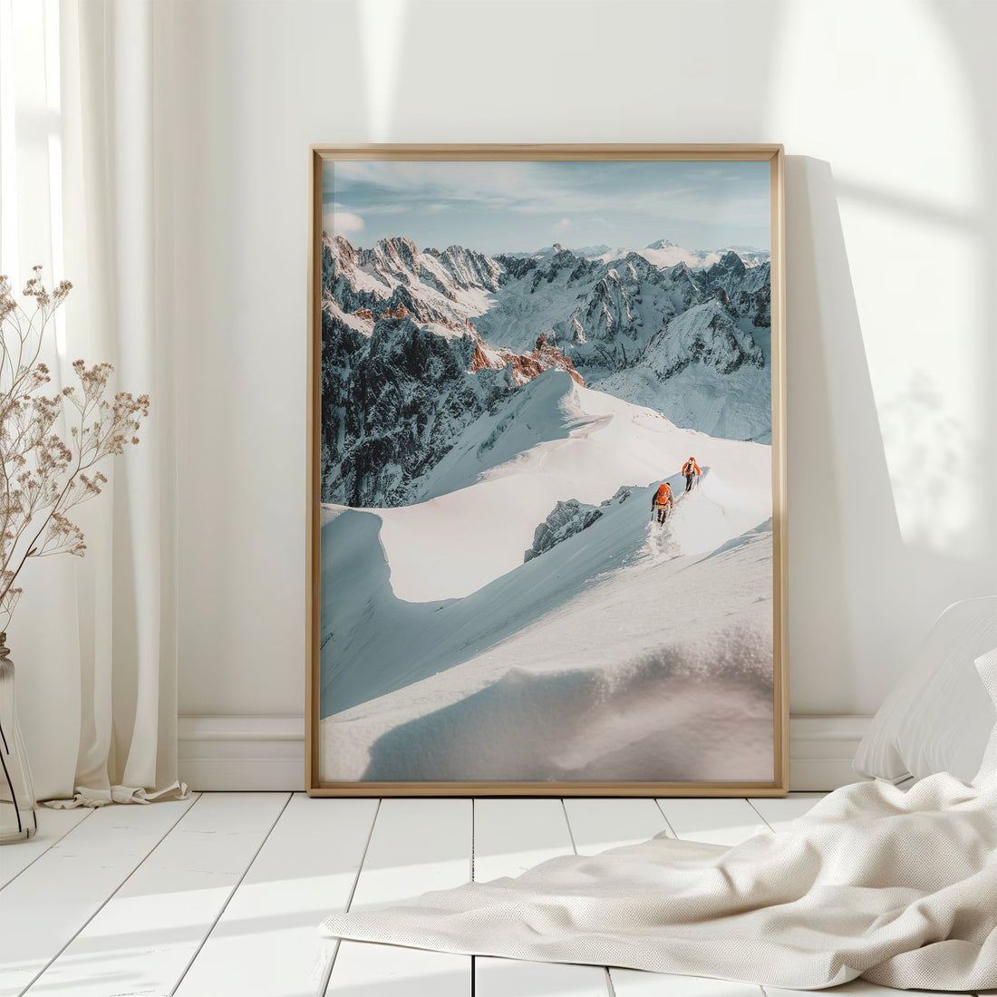 High-adrenaline alpine climbing photography featuring mountaineers ascending a snowy ridge in the Alps.
