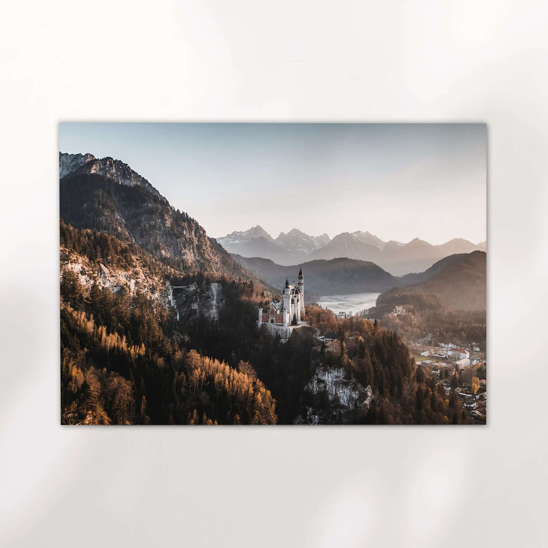 Neuschwanstein Castle surrounded by Bavarian Alps in soft evening light