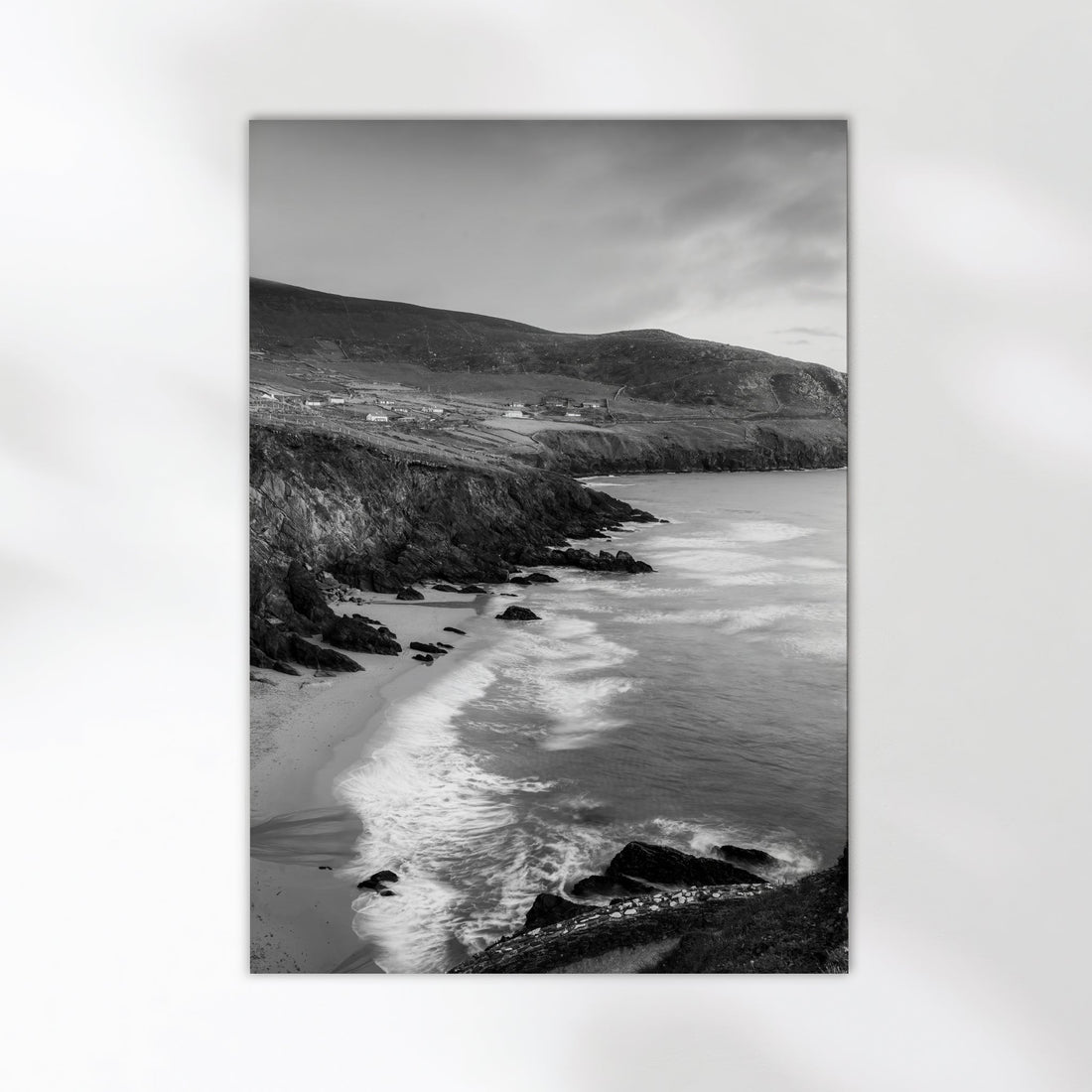 Monochrome Irish coastal scene showing dramatic waves at Coumeenoole Beach