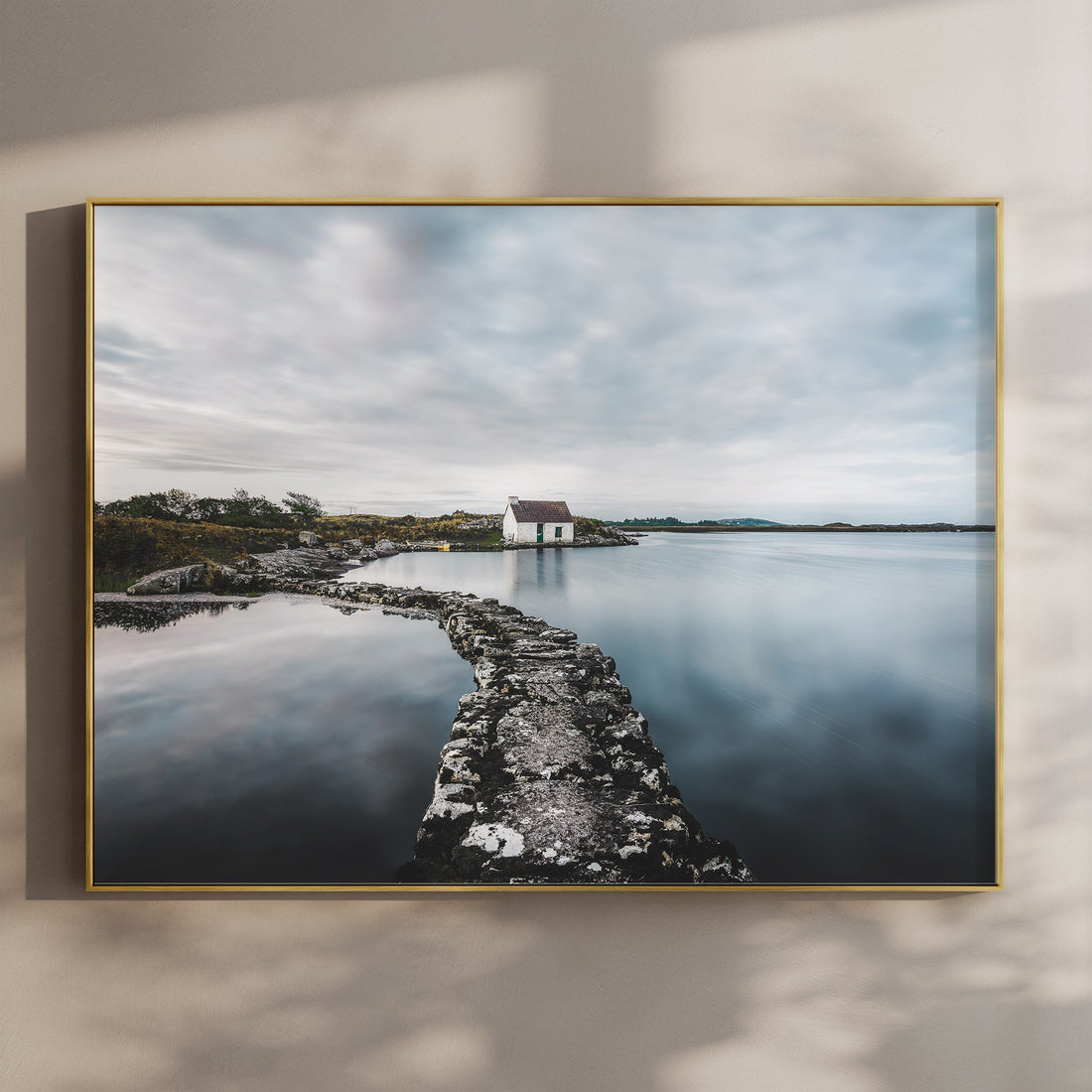 Framed wall art of a fisherman’s bothy in Connemara with soft natural lighting.