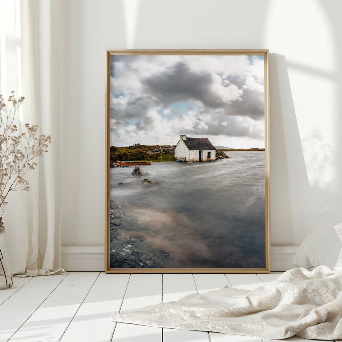 Framed print of traditional Irish cottage by the water