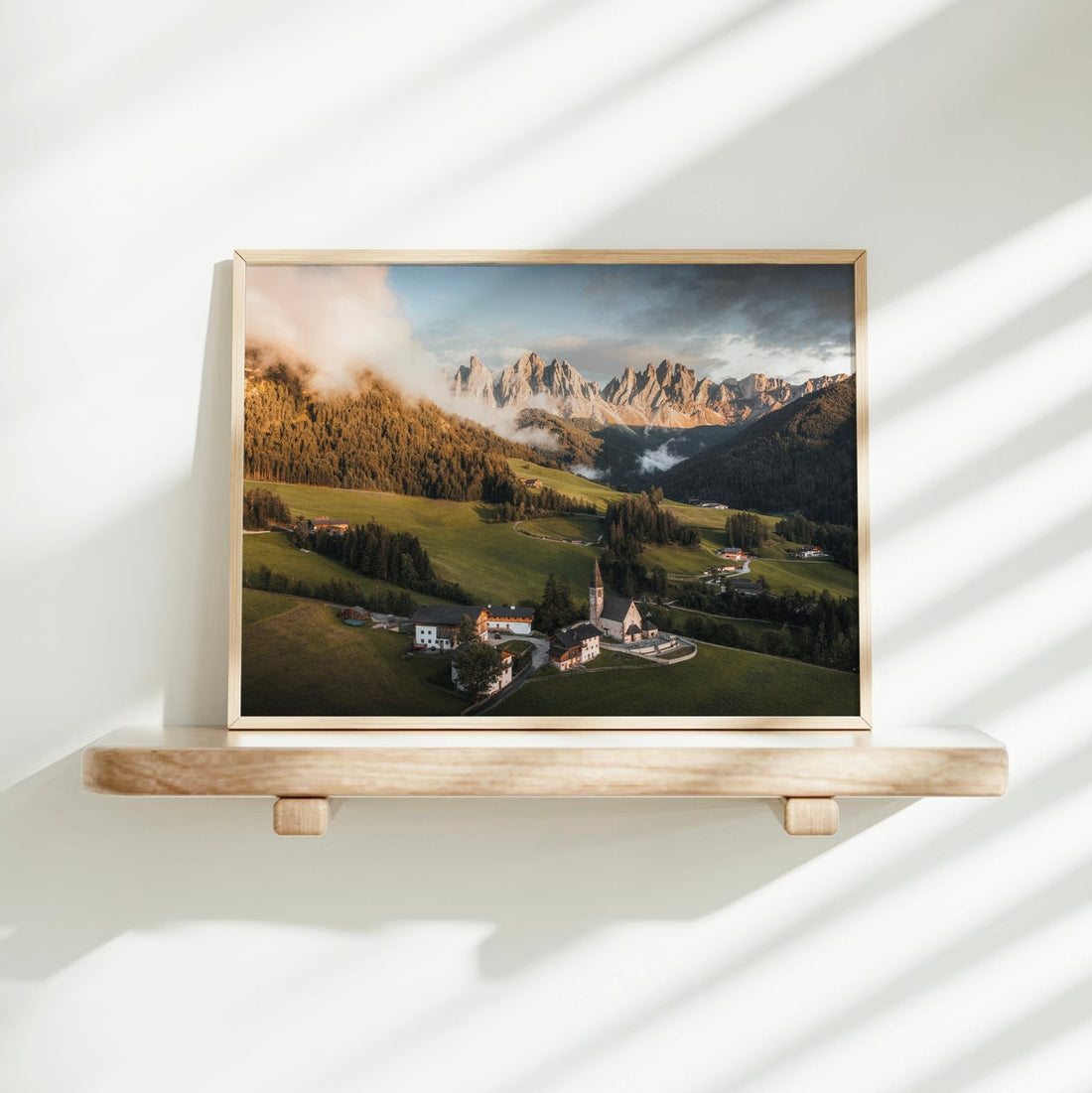 St. Magdalena Dolomites print on wooden shelf with sunlight shadows