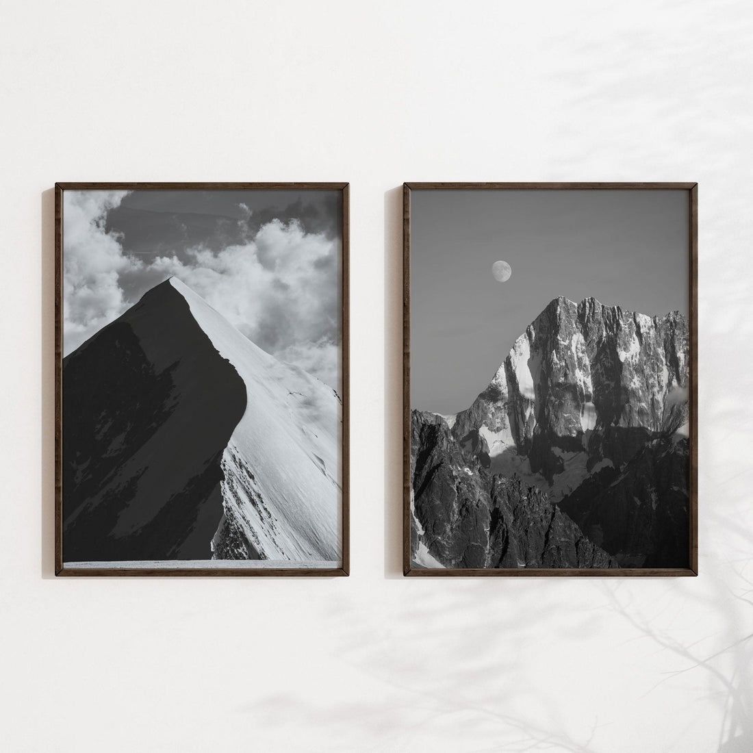 Pair of framed monochrome prints of Aiguille de Bionnassay and Grand Jorasses on a contemporary shelf