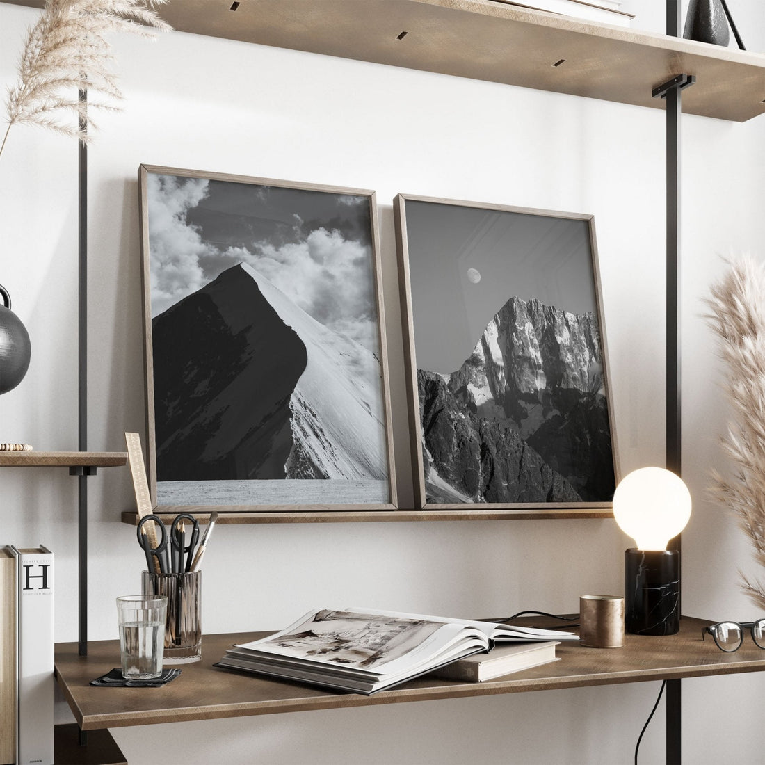 Elegant framed mountain prints displayed in a bright Scandinavian-inspired home office.