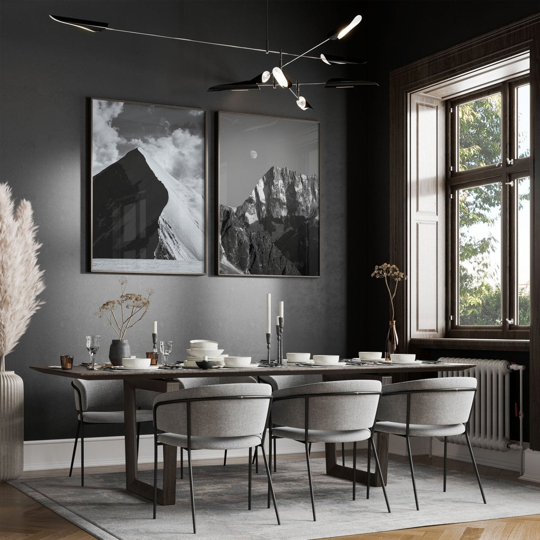 Modern dining room with large framed mountain prints of Aiguille de Bionnassay and Grand Jorasses.